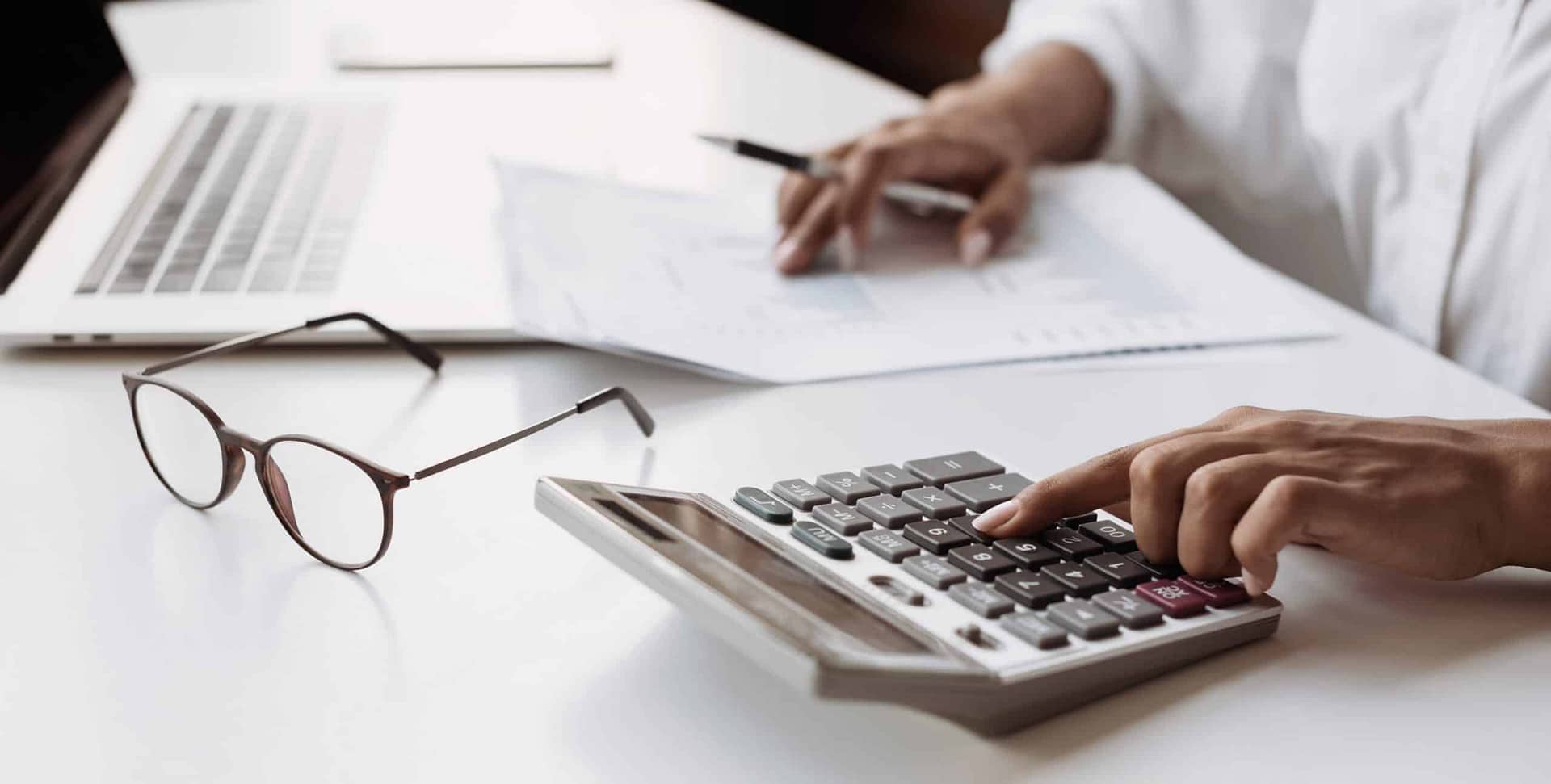 Business woman accountant, financial advisor or banker making calculations
